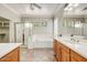 Bathroom with dual vanity sinks, soaking tub, and separate shower at 13633 W Alvarado Dr, Goodyear, AZ 85395