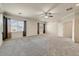 Spacious bedroom with neutral carpet, ceiling fan, and great natural light at 13633 W Alvarado Dr, Goodyear, AZ 85395