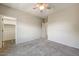 Spacious bedroom with carpet, closet, and access to the hallway at 13633 W Alvarado Dr, Goodyear, AZ 85395