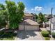 Two-story home with a three-car garage and lush landscaping at 13633 W Alvarado Dr, Goodyear, AZ 85395