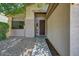 Close-up view of the front entrance showing the modern front door and neat landscaping at 13633 W Alvarado Dr, Goodyear, AZ 85395