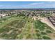 Expansive golf course aerial view with green fairways and blue sky backdrop at 13633 W Alvarado Dr, Goodyear, AZ 85395