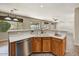 Kitchen sink with stainless steel dishwasher and window overlooking the backyard at 13633 W Alvarado Dr, Goodyear, AZ 85395