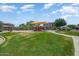 Community playground offering a fun and safe play area for children with slides and swings at 13633 W Alvarado Dr, Goodyear, AZ 85395