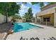 Backyard pool with lush landscaping and easy access to the home at 13633 W Alvarado Dr, Goodyear, AZ 85395