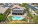Stunning aerial view of the backyard featuring a sparkling pool, putting green, patio, and outdoor seating area at 1365 N Drexel St, Mesa, AZ 85207