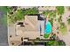 A home with a private backyard oasis, including a pool, spa, and outdoor dining area at 1365 N Drexel St, Mesa, AZ 85207