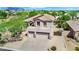 This aerial view highlights a beautiful desert home with a three-car garage and well-maintained landscaping at 1365 N Drexel St, Mesa, AZ 85207