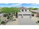 An aerial view showcases the desert home with a three-car garage and xeriscaping for a low-water landscape at 1365 N Drexel St, Mesa, AZ 85207