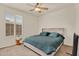 Bright bedroom features plantation shutters, ceiling fan and neutral color palette at 1365 N Drexel St, Mesa, AZ 85207