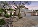 Stunning exterior view of the home during sunset, highlighting the architecture and desert landscaping at 1365 N Drexel St, Mesa, AZ 85207