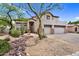 Beautiful two-story home featuring a three-car garage and desert landscaping for a classic curb appeal at 1365 N Drexel St, Mesa, AZ 85207