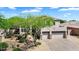 An aerial view showcases the home's three-car garage and low-maintenance desert landscaping at 1365 N Drexel St, Mesa, AZ 85207
