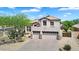 Home with a three-car garage and desert landscape features a well-maintained exterior in a desirable location at 1365 N Drexel St, Mesa, AZ 85207
