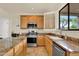 Kitchen with stainless steel appliances, granite countertops and ample cabinet space at 1365 N Drexel St, Mesa, AZ 85207