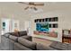 Living room with large sectional sofa, entertainment center and gaming machine at 1365 N Drexel St, Mesa, AZ 85207