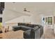Spacious living room features a large sectional sofa, ceiling fan and views to a hallway at 1365 N Drexel St, Mesa, AZ 85207