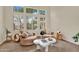 Bright sitting room with large windows and white shutters at 1365 N Drexel St, Mesa, AZ 85207
