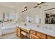Main bathroom with double sinks, a soaking tub and natural light at 1365 N Drexel St, Mesa, AZ 85207