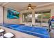 Outdoor patio with a built-in bar, ceiling fan, and comfortable seating area at 1365 N Drexel St, Mesa, AZ 85207