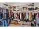 Walk-in closet with built in shelves and clothing racks at 1365 N Drexel St, Mesa, AZ 85207