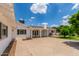 Spacious backyard features a covered patio, desert landscaping, and grass at 1407 E 1St St, Mesa, AZ 85203