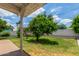 Relaxing covered backyard patio features mature trees at 1407 E 1St St, Mesa, AZ 85203