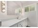 Bright bathroom features a large mirror, vanity, and ample counter space at 1407 E 1St St, Mesa, AZ 85203