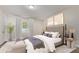 Bright bedroom with a cozy vibe with large window and contemporary decor at 1407 E 1St St, Mesa, AZ 85203