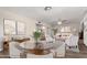 Dining room with a glass-top table and white chairs at 1407 E 1St St, Mesa, AZ 85203