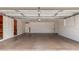 Bright two-car garage featuring block walls, shelves and an automatic door at 1407 E 1St St, Mesa, AZ 85203