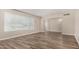 Bright living room with a large window, modern flooring, and neutral-colored walls creating a spacious and airy atmosphere at 1407 E 1St St, Mesa, AZ 85203