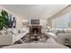 Staged living room with a brick fireplace, built-in shelving, and modern flooring that creates a cozy and inviting atmosphere at 1407 E 1St St, Mesa, AZ 85203