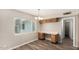 Home office with built-in desk, drawers, and a large window at 1407 E 1St St, Mesa, AZ 85203