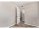 Room with neutral paint, wood-look floors, and view of another room at 1407 E 1St St, Mesa, AZ 85203