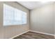 Room with wood-look floors, window, and neutral paint at 1407 E 1St St, Mesa, AZ 85203