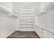Spacious walk-in closet features custom shelving and drawers for optimal organization at 1407 E 1St St, Mesa, AZ 85203