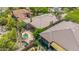 Aerial view highlights the backyard with a cozy spa, outdoor seating, and a serene desert landscape, blending leisure and nature at 15953 N 111Th Way, Scottsdale, AZ 85255