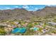 Aerial image features a community area with tennis courts and pool, set against a mountain backdrop, promoting active lifestyles at 15953 N 111Th Way, Scottsdale, AZ 85255