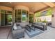 Stylish covered patio with comfortable seating, perfect for entertaining or relaxing outdoors at 15953 N 111Th Way, Scottsdale, AZ 85255