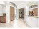 Bright foyer with tile flooring, arched doorways, and a view into the office at 15953 N 111Th Way, Scottsdale, AZ 85255