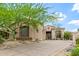 Charming home featuring desert landscaping, mature tree, and tiled roof at 15953 N 111Th Way, Scottsdale, AZ 85255