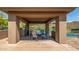 Charming gazebo featuring a table and chairs, offering a shaded retreat with scenic views of the tennis court at 15953 N 111Th Way, Scottsdale, AZ 85255