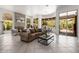Spacious living room with fireplace, large windows, and an open concept layout at 15953 N 111Th Way, Scottsdale, AZ 85255