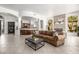 Inviting living area with a comfortable sofa and a view into the kitchen at 15953 N 111Th Way, Scottsdale, AZ 85255