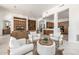 Spacious living area features wood built-ins, contemporary furniture, and an open layout leading to the kitchen at 15953 N 111Th Way, Scottsdale, AZ 85255
