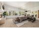 Large main bedroom boasts a fireplace, plantation shutters, and oversized windows with outside views at 15953 N 111Th Way, Scottsdale, AZ 85255