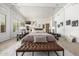 Spacious main bedroom features mirrored wall, fireplace, plantation shutters, and decorative furnishings at 15953 N 111Th Way, Scottsdale, AZ 85255