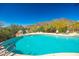 A beautiful pool with the desert hills in the background at 15953 N 111Th Way, Scottsdale, AZ 85255