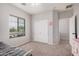 Bright bedroom with a large window, and comfortable bed at 16284 W Desert Mirage Dr, Surprise, AZ 85379